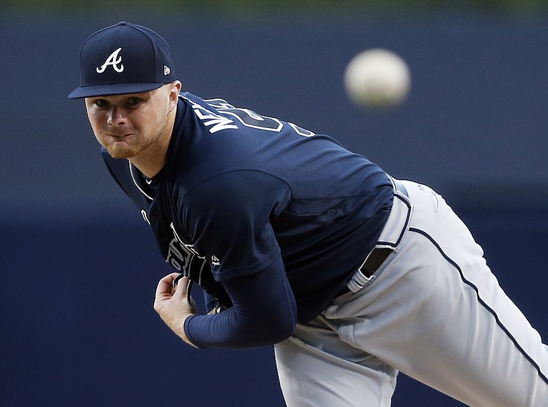 Atlanta Braves starting pitcher Sean Newcomb watches a throw during the first inning of the team's baseball game against the San Diego Padres in San Diego, Tuesday, June 27, 2017. (AP Photo/Alex Gallardo)