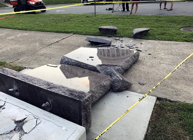 The new Ten Commandments monument outside the state Capitol in Little Rock, Ark., is blocked off Wednesday morning, June 28, 2017, after someone crashed into it with a vehicle, less than 24 hours after the privately funded monument was installed on the Capitol grounds. Authorities arrested a male suspect. (AP Photo/Jill Zeman Bleed)

