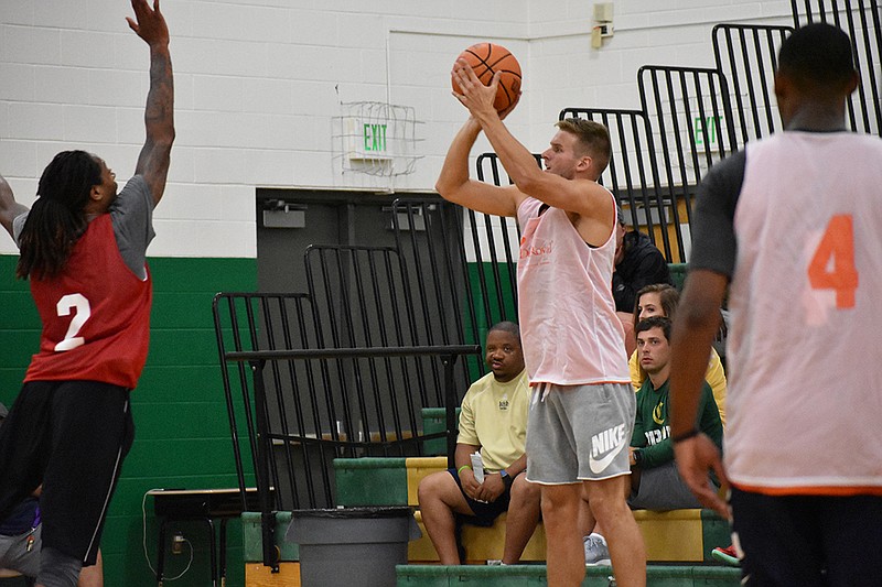 Lee University guard and former Meigs County standout Levi Woods takes a shot during a recent Rocky Top League league game in Knoxville. Woods and other Chattanooga area players participate in the league, which features several University of Tennessee players.