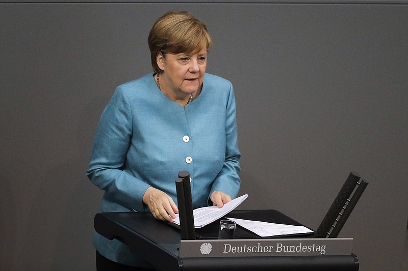 
              German Chancellor Angela Merkel delivers her speech about last week's EU Summit and the upcoming G-20 Summit at the German parliament Bundestag in Berlin, Thursday, June 29, 2017. (AP Photo/Markus Schreiber)
            