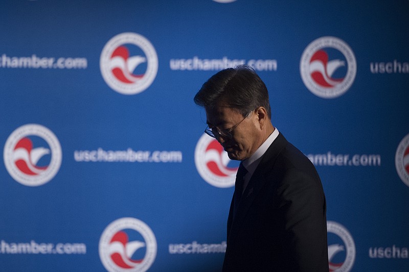 
              South Korean President Moon Jae-in walks offstage after speaking at a dinner hosted by the U.S. Chamber of Commerce and the South Korean Chamber of Commerce in Washington, Wednesday, June 28, 2017. (AP Photo/Cliff Owen)
            