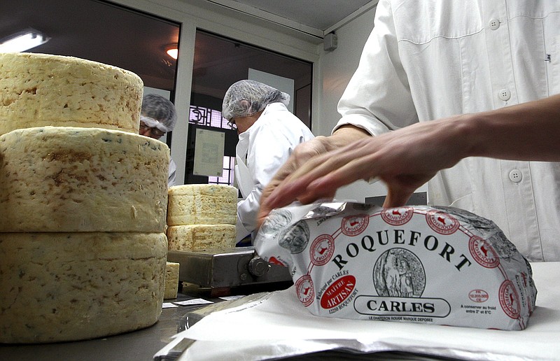 
              FILE - In this Jan. 22, 2009, file photo, French family company Carles employees work at Carles Roquefort cheese factory in Roquefort, southwestern France. Japan and the European Union are hoping to reach an economic partnership agreement within days, countering the backlash against free trade by U.S. President Donald Trump. Their trade and agriculture ministers are due to meet in Tokyo on Friday, June 30, 2017, trying to forge a deal before the Group of 20 industrial nations meets next week in Germany. Local reports said a main point of disagreement was Japan's up to 40 percent tariffs on imported cheese. (AP Photo/Bob Edme, File)
            