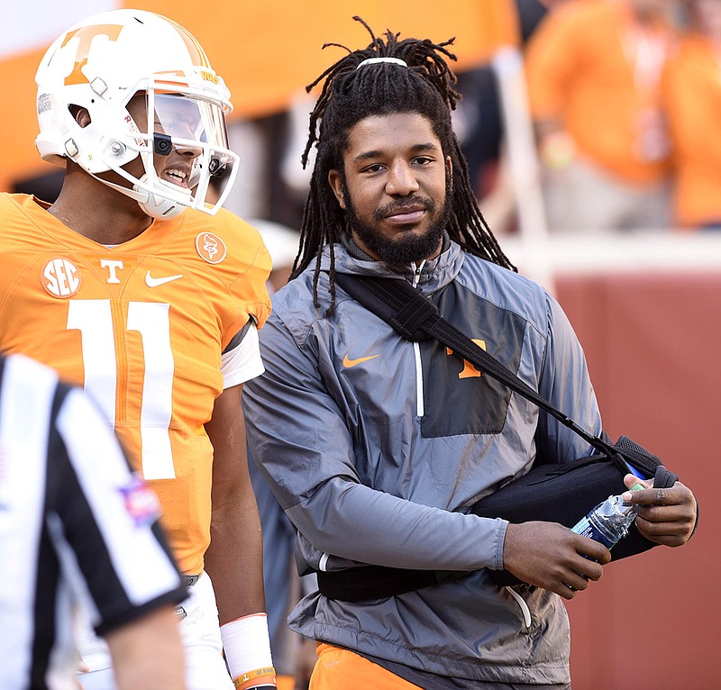 Jalen Reeves-Maybin, right, listens to Joshua Dobbs during Tennessee's homecoming game against Tennessee Tech last November. Reeves-Maybin, a linebacker, missed much of his senior season because of an injury, but he was drafted by the Detroit Lions in the fourth round in April.
