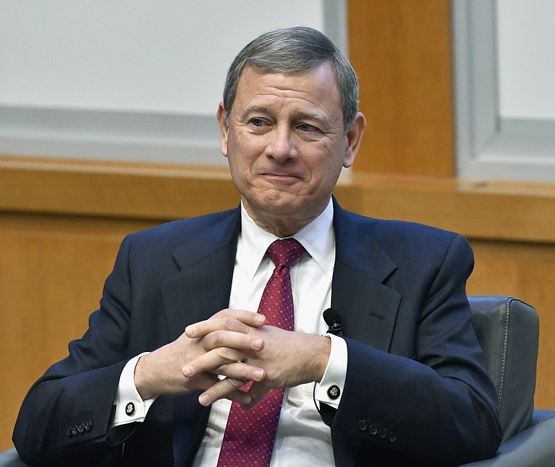 
              FILE- In this Feb. 1, 2017, file photo, U.S. Supreme Court Chief Justice John Roberts prepares to speak at the The John G. Heyburn II Initiative and University of Kentucky College of Law's judicial conference and speaker series in Lexington, Ky. Roberts said pop culture references can be the perfect way to make a legal point, but he warns they carry some risk. Roberts discussed his role on the Supreme Court on Friday, June 30 in Lancaster, Pa., at a meeting of the Judicial Conference of the District of Columbia Circuit. (AP Photo/Timothy D. Easley, File)
            