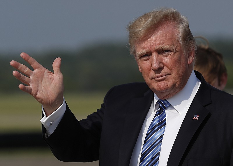 
              In this June 30, 2017, photo, President Donald Trump waves as he arrive on Air Force One at Morristown Municipal Airport, in Morristown, N.J. Trump will make remarks honoring veterans at a Kennedy Center event on July 1, hosted by an evangelical megachurch. Trump is spending the weekend at his golf club in Bedminster, New Jersey, but planned to briefly travel back to Washington on Saturday night for the “Celebrate Freedom Rally” at the John F. Kennedy Center for the Performing Arts. (AP Photo/Carolyn Kaster)
            