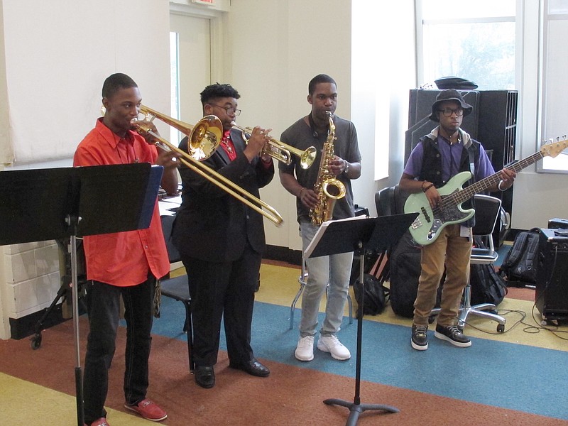 
              A group of Stax Music Academy musicians rehearse for their upcoming tour of Europe on Friday, June 30, 2017 in Memphis, Tenn. Fifty years after the Stax Records tour, a group of young musicians educated at Stax Music Academy are again bringing the music of Memphis back to Europe. (AP Photo/Adrian Sainz)
            