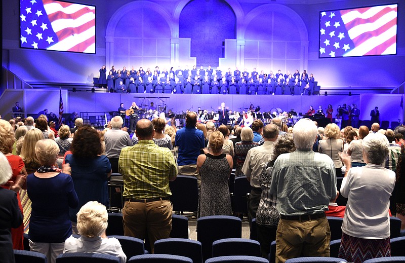 The Zadock Choir and Orchestra have the congregation on their feet.  Former Pastor and Governor of Arkansas Mike Huckabee spoke at Abba's House, in Hixson, on All American Day on July 2, 2017.  
