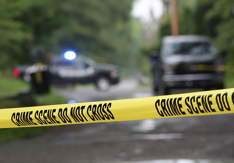 Crime scene tape surrounds a few houses during a police-involved shooting and stabbing investigation Monday, July 3, 2017, in Walker County, Ga. One police officer was stabbed multiple times, but all were considered non-life-threatening injuries. 