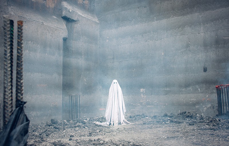 This image released by A24 shows a scene from the film, "A Ghost Story." (Bret Curry/A24 via AP)