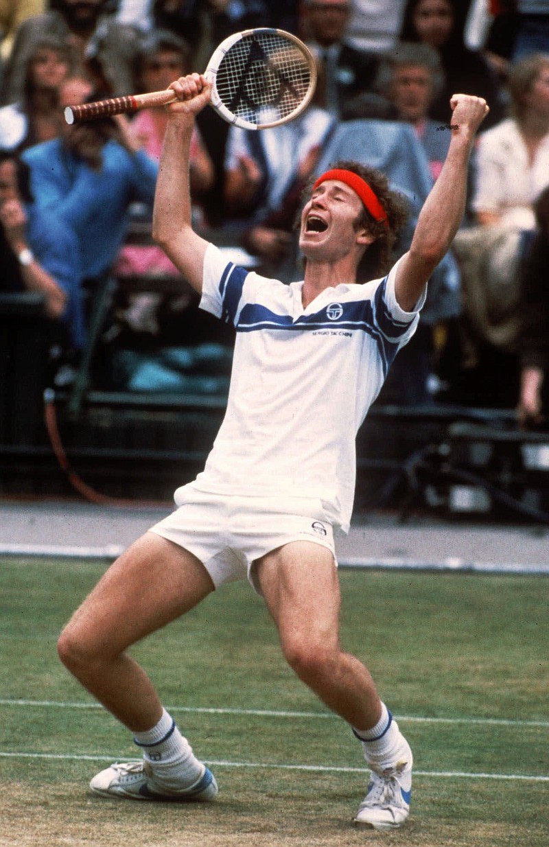 FILE - In this July 4, 1981 file photo, John McEnroe celebrates his victory after defeating Bjorn Borg to take the men's singles title at the All-England Lawn Tennis Championships in Wimbledon, London.  A year after losing to Borg, in one of the greatest matches ever played, McEnroe got his revenge ending Borgs 5 year domination of Wimbledon. The serve-and-volley tactics of McEnroe, who had caused some controversy earlier in the tournament with a couple of foul-mouthed tirades, proved too much for Borg, who lost in four sets. McEnroe would win another two Wimbledons. Borg never graced the tournament again. (AP Photo/Adam Stoltman, File)