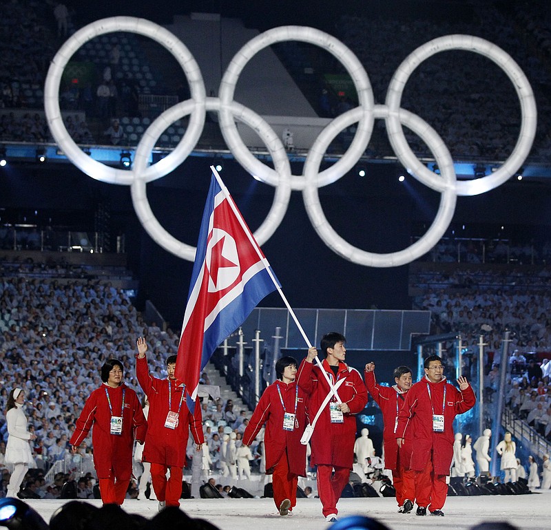 
              FILE - In this Feb 12, 2010 file photo, North Korea's Song Chol Ri carries the flag during the opening ceremony for the Vancouver 2010 Olympics in Vancouver, Canada. Seven months ahead of the Pyeongchang Olympics, many in South Korea, including new liberal President Moon Jae-in, hope to use the Games as a venue to promote peace with rival North Korea. To do so, the North’s participation is essential, but an ongoing nuclear tension and a lack of winter sports athletes in North Korea could ruin the attempts at reconciliation. (AP Photo/Mark Baker, File)
            