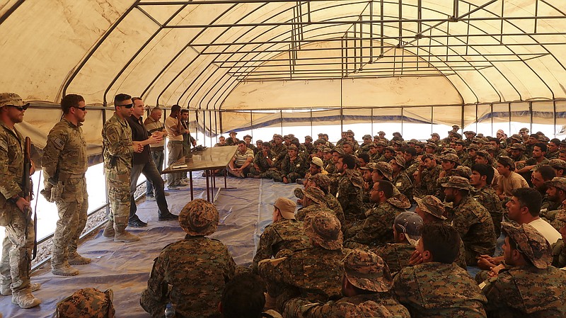 Brett McGurk, President Donald Trump's special envoy, speaks to recruits being trained to perform security duties in and around Raqqa, including Tabqa, Syria, last Friday. The United States' strategy in Syria is to wage the ground campaign against the Islamic State through local forces in order to maintain a small American footprint.