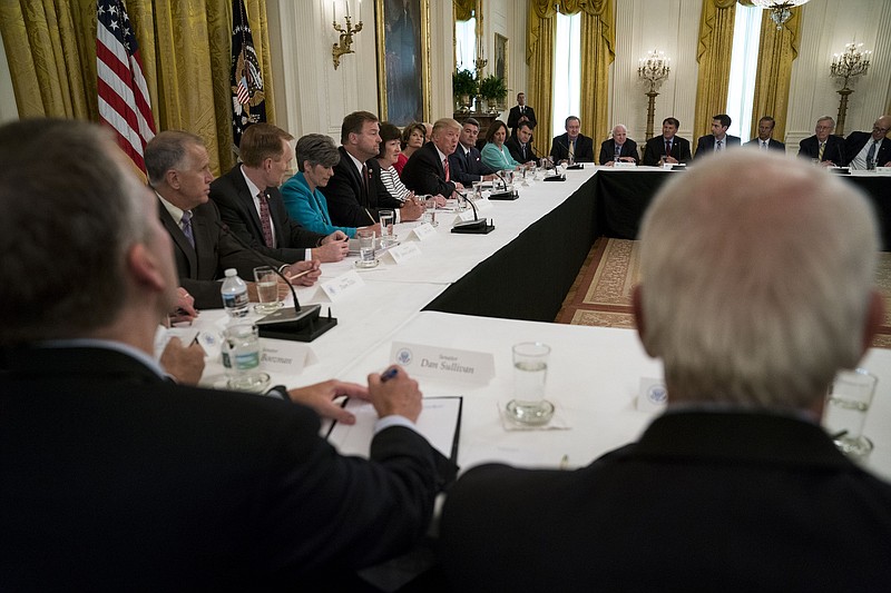 FILE -- President Donald Trump meets with Republican members of the Senate to discuss health care in the East Room of the White House in Washington, June 27, 2017. As Republicans struggle to reach an agreement on a plan to repeal and replace the Affordable Care Act, Trump complicated talks with an old idea, suggesting the Senate could repeal President Barack Obama’s health care act now, then replace it later. (Doug Mills/The New York Times) 