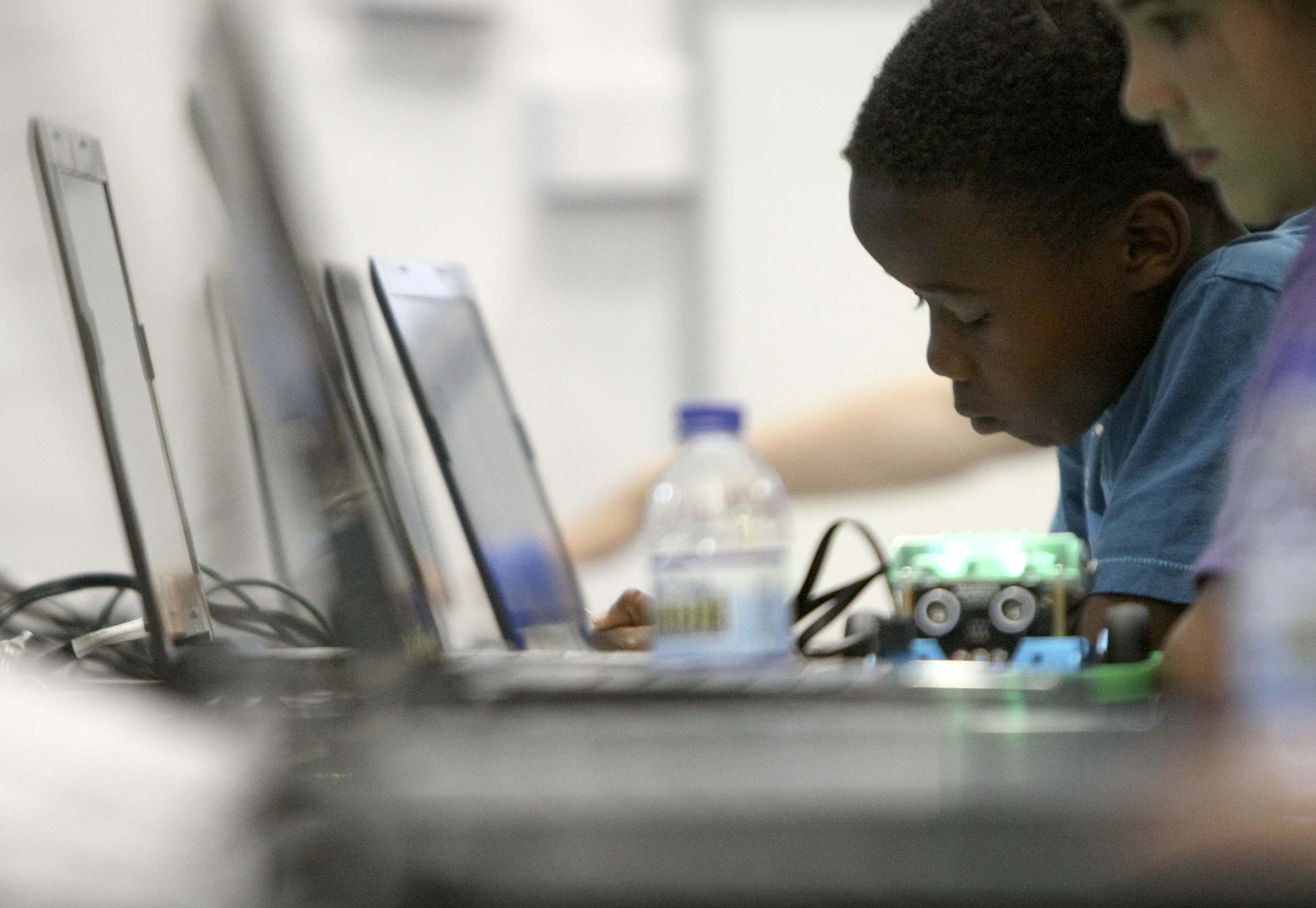 Tariq Jones, 6, works with robots during Tech Town camp at the Edeny Building on Thursday, June 29, in Chattanooga, Tenn.