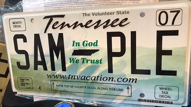 A sample "In God We Trust" vehicle tag is shown. (Photo contributed by the Hamilton County Clerk's Office)