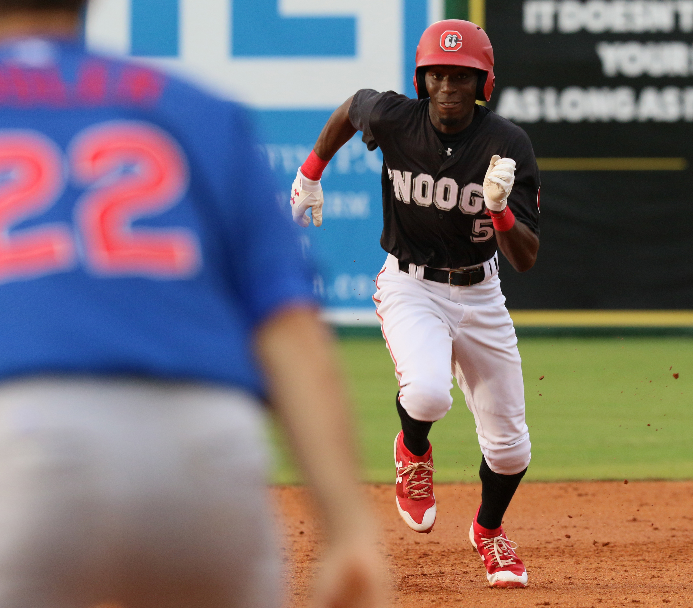 Chattanooga's Nick Gordon (5) sprints to third as he sees the ball is loose during the Chattanooga Lookouts' game against the Tennessee Smokies Wednesday, July 5, 2017, in Southern League baseball at AT&T Field in Chattanooga, Tenn.