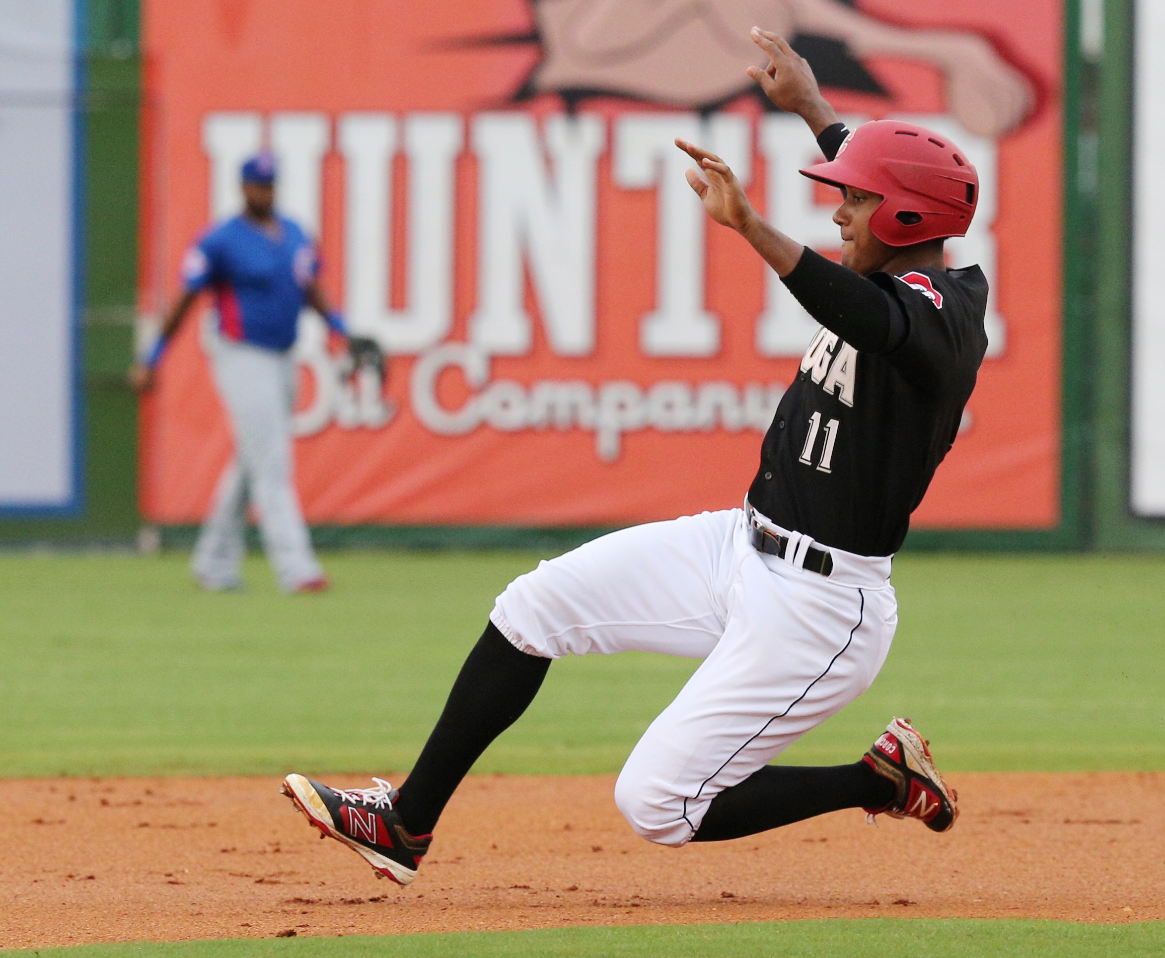 Chattanooga's Edgar Corcino (11) safely slides into second base during the Chattanooga Lookouts' game against the Tennessee Smokies Wednesday, July 5, 2017, in Southern League baseball at AT&T Field in Chattanooga, Tenn.