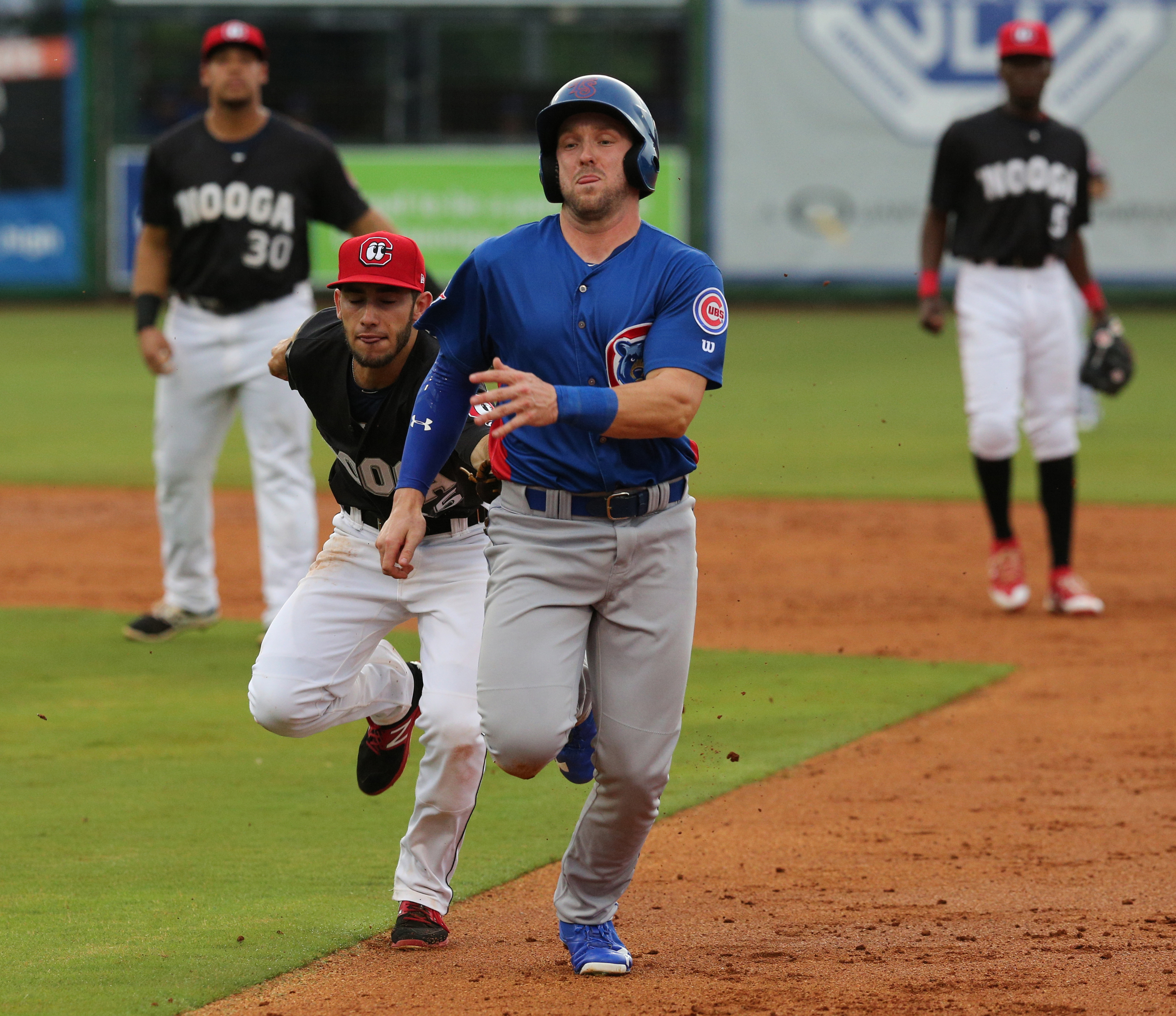 Chattanooga second baseman Alex Perez (35) tags Smokies' Ian Rice (5) out in a rundown during the Chattanooga Lookouts' game against the Tennessee Smokies Wednesday, July 5, 2017, in Southern League baseball at AT&T Field in Chattanooga, Tenn.