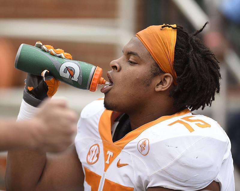 Tennessee offensive guard Jashon Robertson takes a break between series during the Vols' spring football game at Neyland Stadium in April. Robertson and fellow seniors Emmanuel Moseley and Kendal Vickers will represent the team next week at SEC Media Days.