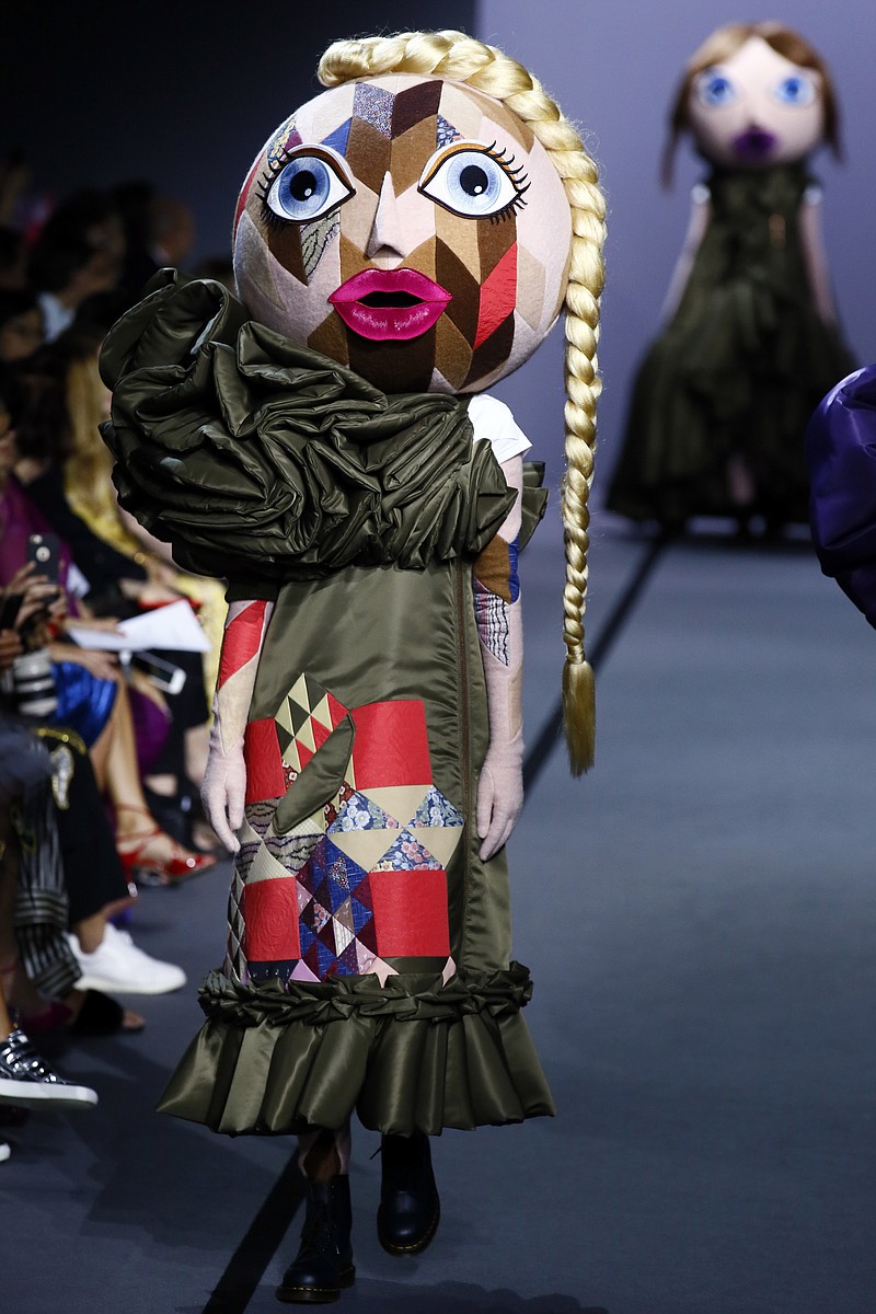 
              A model wears a creation for Viktor and Rolf's Haute Couture Fall/Winter 2017/2018 fashion collection presented in Paris, Wednesday, July 5, 2017. (AP Photo/Francois Mori)
            