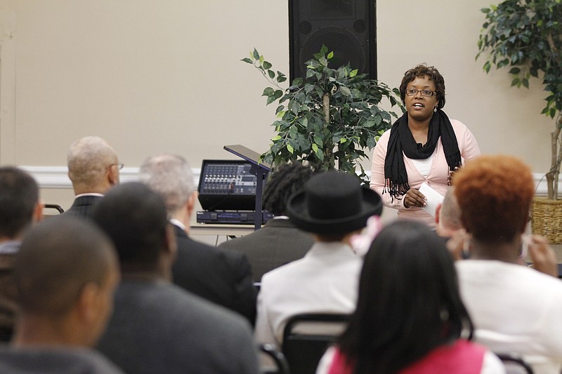 Carol Johnson, a Chattanooga Housing Authority partner, speaks to graduates and their families at an Environmental Job Training Program graduation ceremony in 2012.