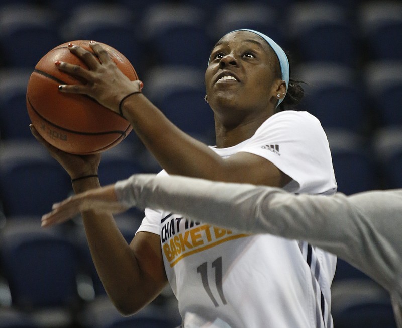 Ka'Vonne Towns shoots during a UTC practice in the 2014-15 season. She is returning to the program as a member of coach Jim Foster's staff.