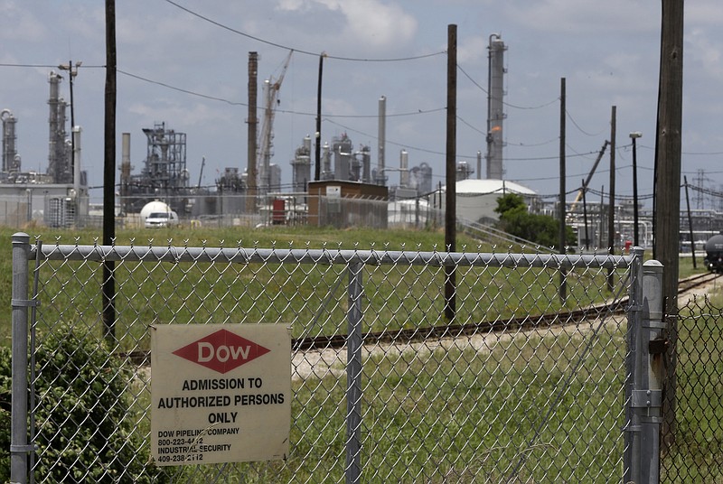 
              FILE - In this May 22, 2014 file photo, a sign is posted on a roadside fence outside a Dow Chemicals plant in Freeport, Texas. A coalition of five states is seeking to join a legal challenge to the Trump administration’s decision to keep a widely used pesticide on the market, despite studies showing it can harm children's brains.  (AP Photo/Pat Sullivan, File)
            