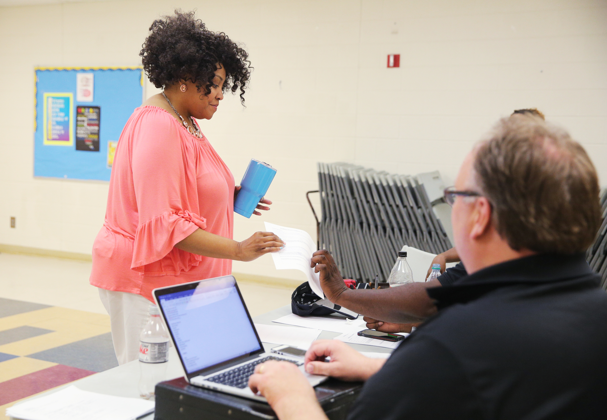 Donna Eady hands over paperwork to the production staff during auditions for The Wiz Monday, June 26, 2017, at the South Chattanooga Recreation Center in Chattanooga, Tenn. The Theatre Center is hoping to draw a diverse cast.