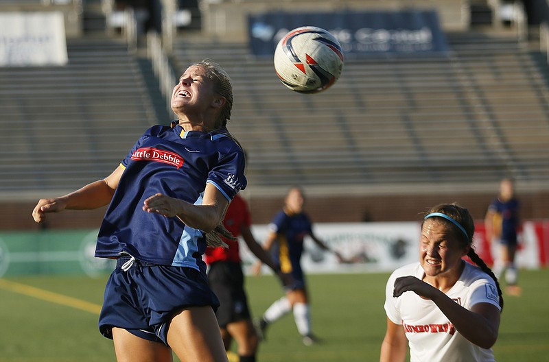 CFC's Summer Lanter, left, heads the ball over Pensacola's Hannah Godfrey during a Chattanooga FC Women's match against the Gulf Coast Texans at Finely Stadium on Saturday, July 8, 2017, in Chattanooga, Tenn.