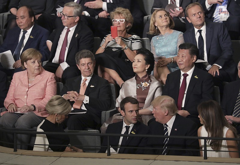 Leaders, including German Chancellor Angela Merkel, left, and their partners attend a concert at the Elbphilharmonie concert hall on the first day of the G-20 summit in Hamburg, northern Germany, Friday, July 7, 2017. (Kay Nietfeld/Pool Photo via AP)