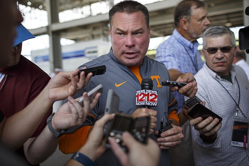 Tennessee football coach Butch Jones speaks to media at the Big Orange Caravan's stop at the First Tennessee Pavilion on Saturday, June 3, 2017, in Chattanooga, Tenn. The event gave fans the chance to meet Tennessee Athletics coaches and new athletic director John Currie.