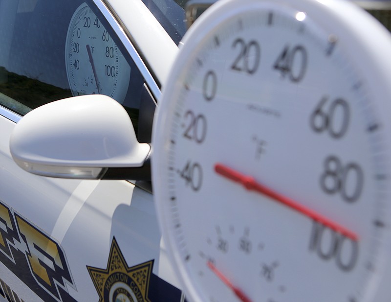 The Hamilton County Sheriff's Office "Look Before You Lock" cruiser is seen outside of the HCSO's West Patrol Annex on Monday, July 10, in Hixson, Tenn. Two thermometers show the difference between the inside temperature of the vehicle and the approximate outside temperature. The outside temperature reads a few degrees higher than the actual temperature due to heat reflections from the vehicle and the asphalt.