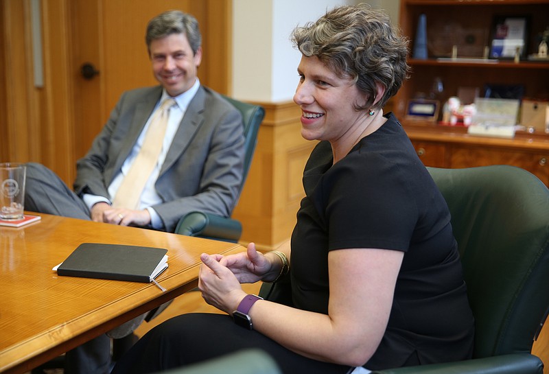 Chattanooga Mayor Andy Berke listens as Ariel Ford speaks about making the move to Chattanooga during an interview at City Hall Thursday, July 6, 2017, in Chattanooga, Tenn. In her first few weeks on the job, Ford has been looking at data and making plans for what her first big actions will be in the new role.