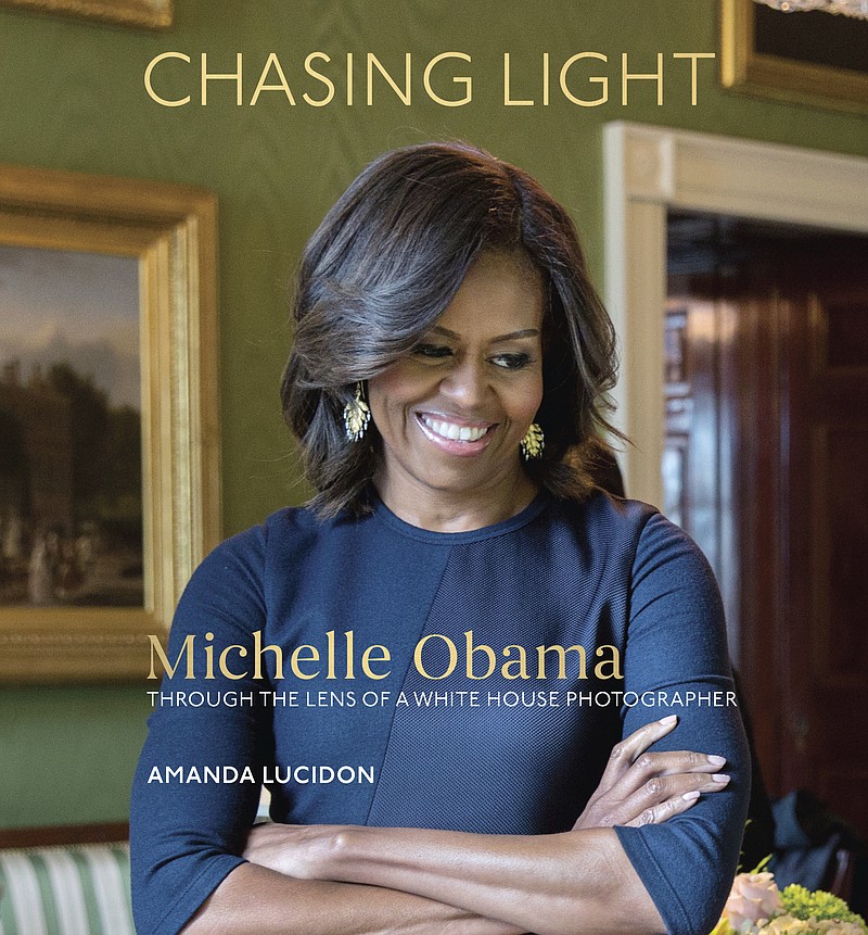 
              This cover image released by Ten Speed Press shows, "Chasing Light: Michelle Obama Through the Lens of a White House Photographer," by Amanda Lucidon. Ten Speed Press told The Associated Press on Tuesday, July 11, 2017, that the collection of White House pictures of Michelle Obama is coming out Oct. 17. (Amanda Lucidon/Ten Speed Press via AP)
            