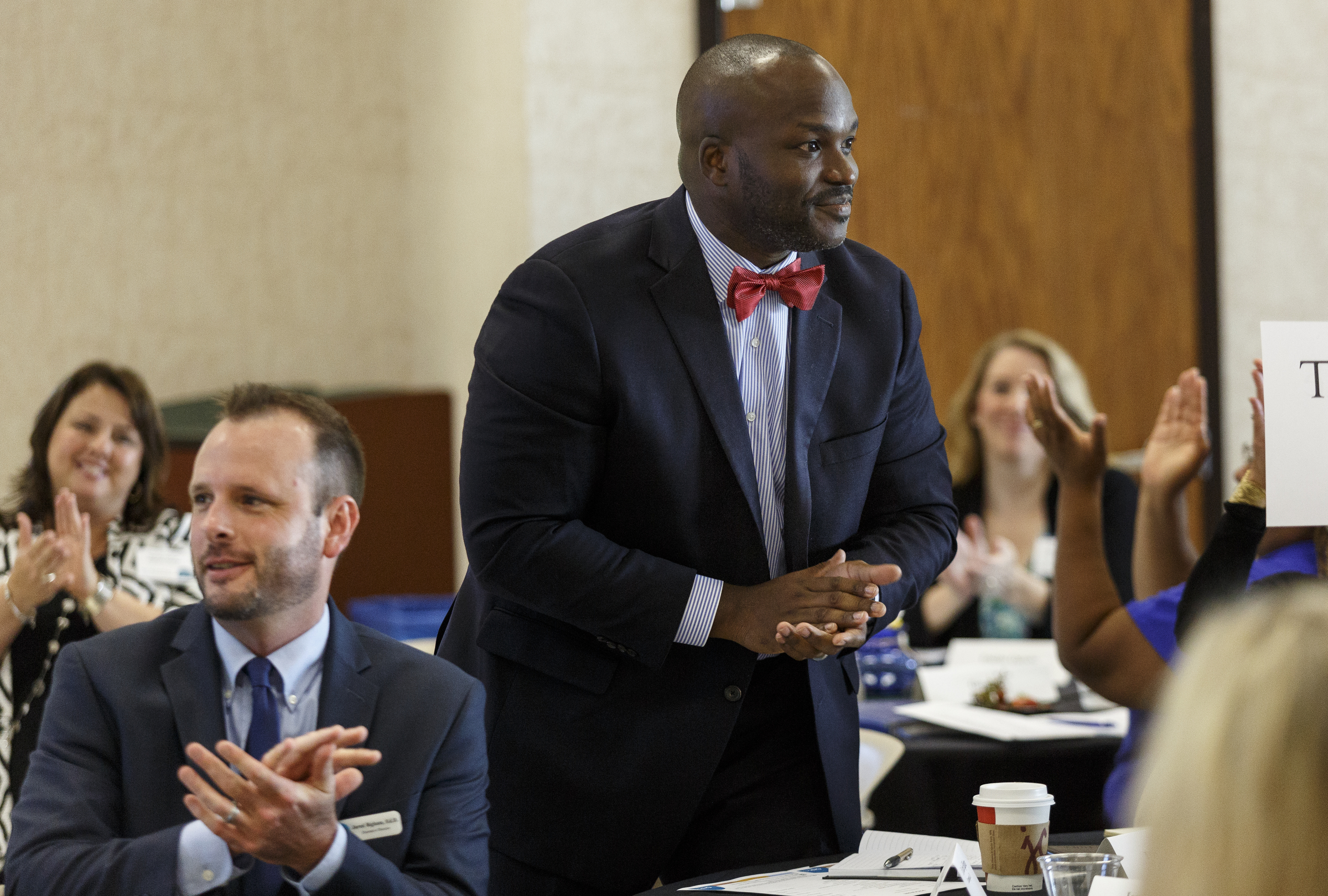 New Hamilton County Schools Superintendent Dr. Bryan Johnson, right, is introduced standing near Chattanooga 2.0's Dr. Jared Bigham during an update on the Chattanooga 2.0 initiative on the campus of the University of Tennessee at Chattanooga on Thursday, July 13, 2017, in Chattanooga, Tenn. Chattanooga 2.0 launched a year ago with the goal of improving education outcomes in Hamilton County.