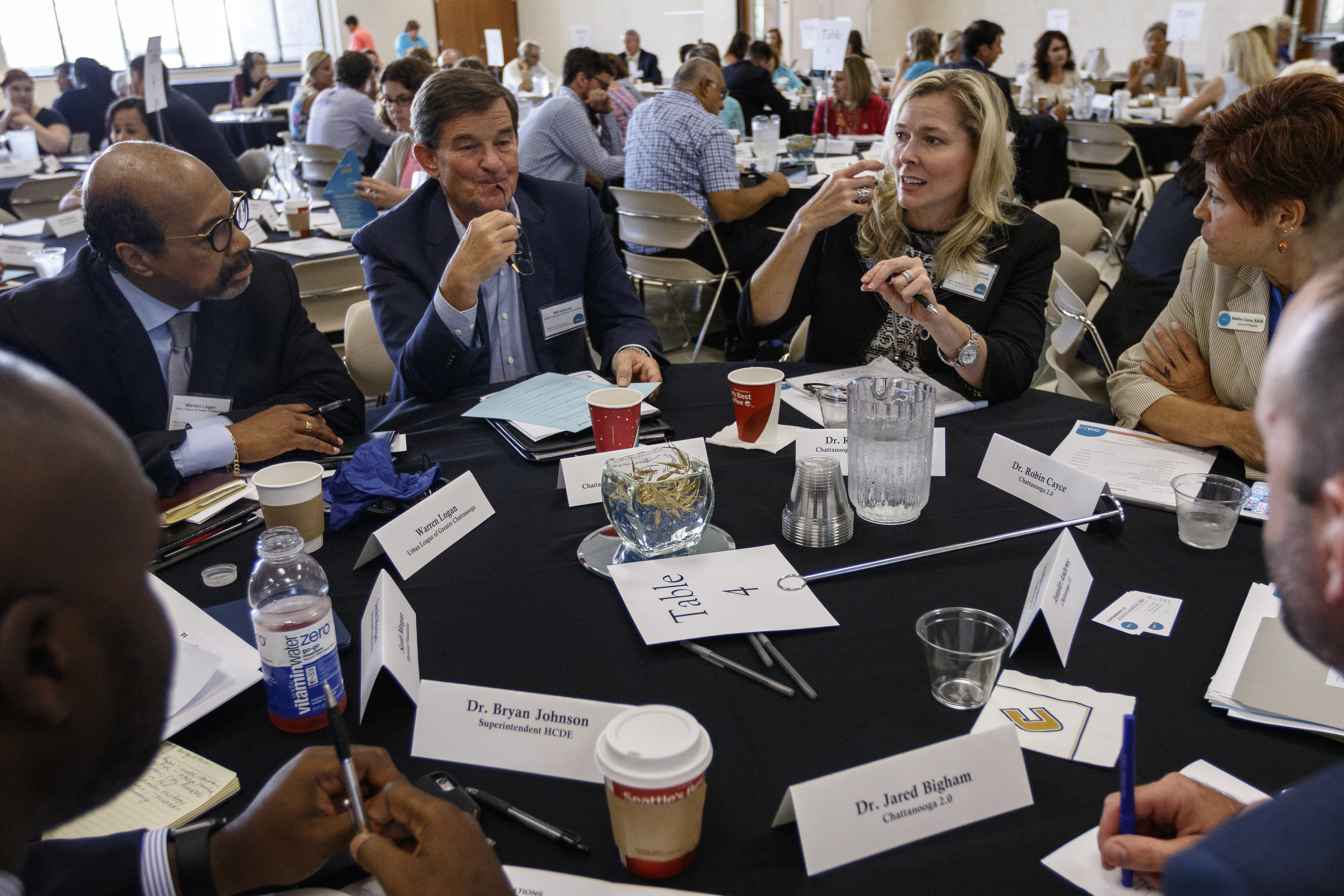 Warren Logan, Bill Kilbride, and Dr. Rebecca Ashford, from left, talk with others in a group during an update on the Chattanooga 2.0 initiative on the campus of the University of Tennessee at Chattanooga on Thursday, July 13, 2017, in Chattanooga, Tenn. Chattanooga 2.0 launched a year ago with the goal of improving education outcomes in Hamilton County.