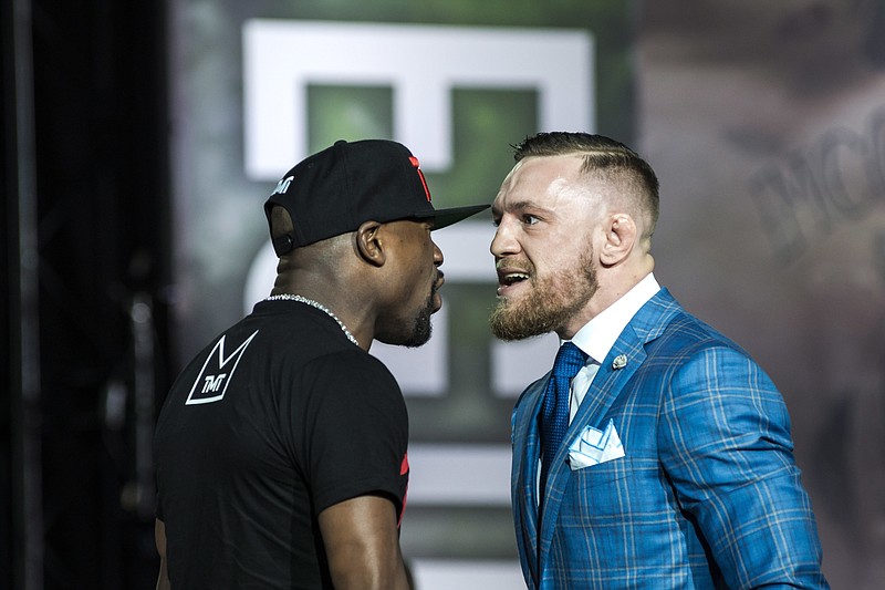 
              Floyd Mayweather, left, and Conor McGregor exchange harsh words during a promotional stop in Toronto on Wednesday, July 12, 2017, for their upcoming boxing match in Las Vegas. (Christopher Katsarov/The Canadian Press via AP)
            