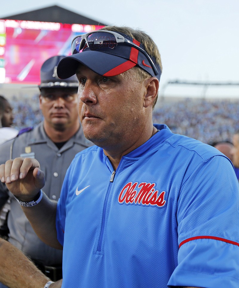 Hugh Freeze, the head coach of the Ole Miss football program at the time, walks off the field on Sept. 17, 2016, after a loss to Alabama in Oxford, Miss.