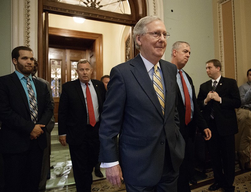 
              Senate Majority Leader Mitch McConnell of Ky. leaves the Senate chamber on Capitol Hill in Washington, Thursday, July 13, 2017, after announcing the revised version of the Republican health care bill. (AP Photo/J. Scott Applewhite)
            