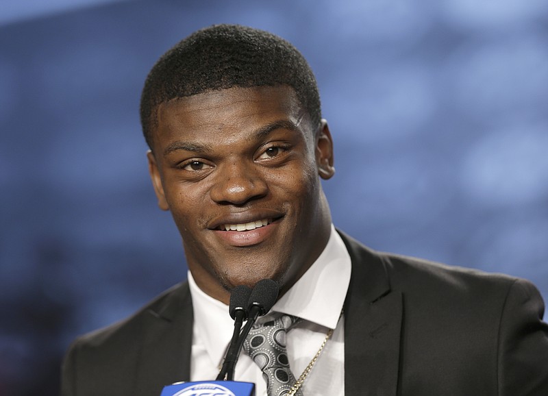 
              Louisville's Lamar Jackson speaks to the media during the Atlantic Coast Conference NCAA college football media day in Charlotte, N.C., Thursday, July 13, 2017. (AP Photo/Chuck Burton)
            