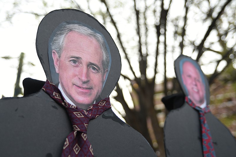 A cut out of Sen. Bob Corker, left, in a February protest on health care reform in Miller Park.
