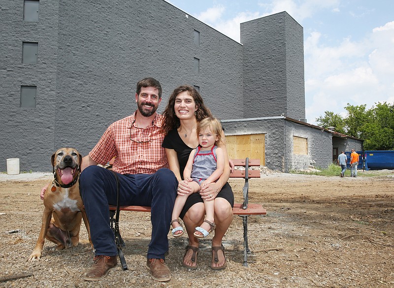 Bode, Bob, Courtney and Adeline Poore pose for a photo Wednesday, July 12, 2017, in front of the Play Wash Pint location in Chattanooga, Tennessee. The business is scheduled to open in late summer. 
