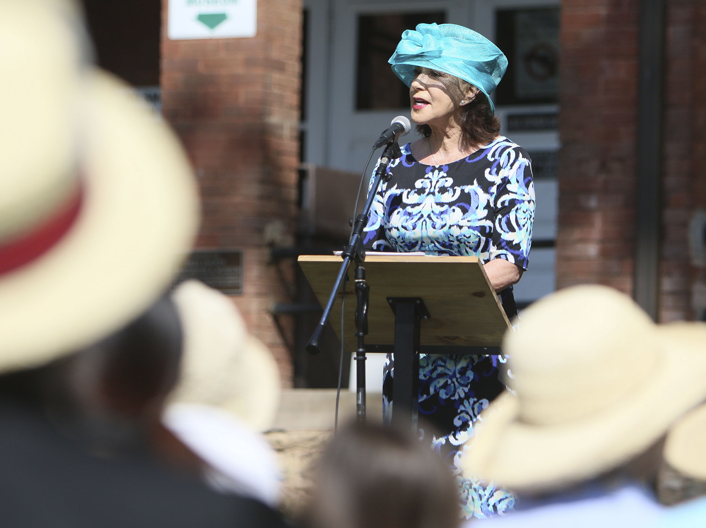 Margaret Downey, who served as the emcee, speaks during the dedication and unveiling event of the Clarence Darrow Commemorative Statue Friday, July 14, 2017, at the Rhea County Courthouse in Dayton, Tenn. The sculpture of Clarence Darrow was donated to the Rhea County Courthouse.