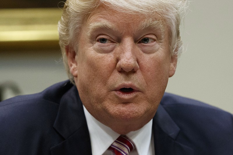 
              FILE - In this Wednesday, March 22, 2017 file photo, President Donald Trump speaks during a meeting on women in healthcare in the Roosevelt Room of the White House in Washington.  Indonesia's intellectual property agency has given preliminary approval to two Donald Trump trademarks.  The agency's database shows the "Trump" and "Trump International" trademarks will become eligible to be officially registered if no one files an objection during a three month window. (AP Photo/Evan Vucci, File)
            