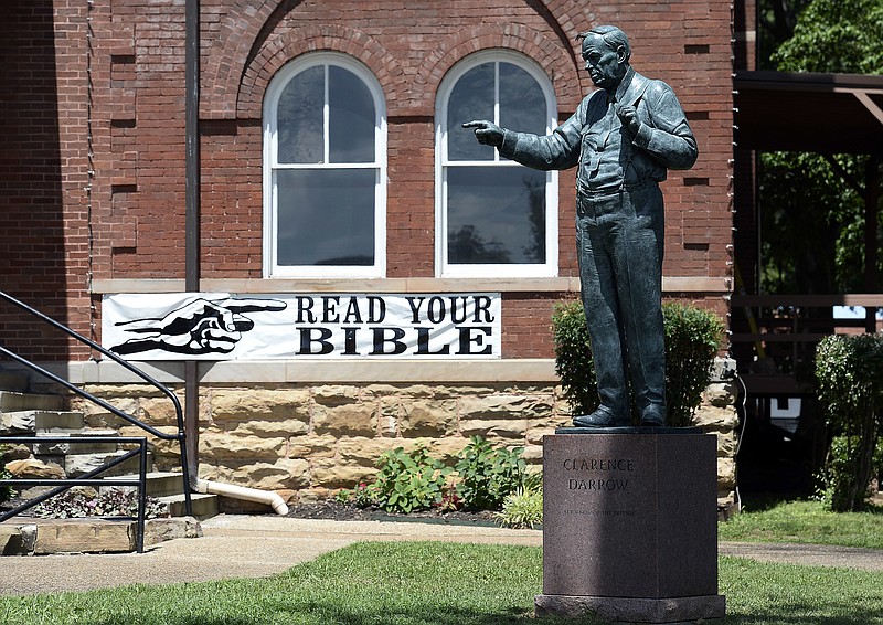 
              A statue of Clarence Darrow stands in front of the Rhea County Courthouse, Friday, July 14, 2017, in Dayton, Tenn. Darrow was the lawyer who defended John T. Scopes, a biology teacher, who fought Tennessee's law banning the teaching of evolution. (AP Photo/Mark Zaleski)
            