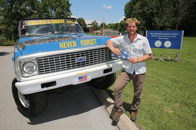 Joshua Kapellusch poses for a photo Friday, July 14, 2017, at the Naval Operational Support Center and Marine Corps Reserve Center on Amnicola Highway in Chattanooga, Tenn. Kapellusch built the truck commemorating the Fallen Five himself, and it runs on five types of fuels.
