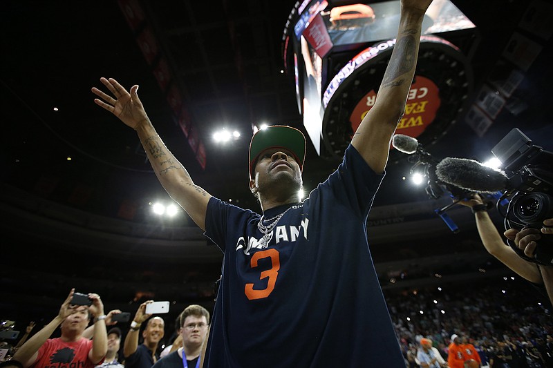 
              3's Company player coach Allen Iverson acknowledges the hometown fans during his introduction before the start of Game 4 against the Tri State in the BIG3 Basketball basketball League in Philadelphia, Pa., Sunday, July 16, 2017. (AP Photo/Rich Schultz)
            