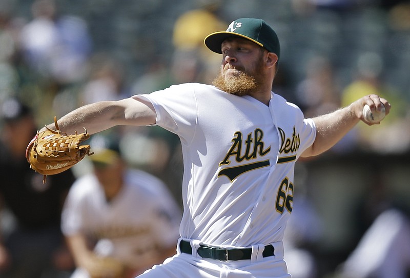 
              FILE - This May 29, 2016 file photo shows Oakland Athletics' Sean Doolittle working against the Detroit Tigers in the ninth inning of a baseball game in Oakland, Calif. The Washington Nationals acquired Doolittle and reliever Ryan Madson from the Oakland Athletics for right-hander Blake Treinen and a pair of prospects, Sunday, July 16, 2017. (AP Photo/Ben Margot, file)
            