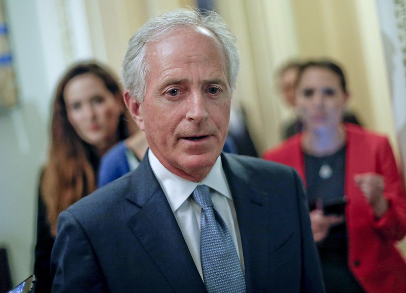 In this May 2, 2017 file photo, Sen. Bob Corker, R-Tenn., speaks to members of the media as he arrives for a policy luncheon with Vice President Mike Pence, on Capitol Hill in Washington. The Trump White House picked the worst possible time to criticize a package of new Russia sanctions that is heading toward almost certain and overwhelming approval by Congress. Corker, the Republican chairman of the Foreign Relations Committee, said the White House offered very little input into the legislation. And now White House complaints over a key section of the bill are drowned out amid stunning revelations on Tuesday, July 11, that President Donald Trump's eldest son met with a Russian lawyer after being promised damaging information on Hillary Clinton supplied by the Kremlin. (AP Photo/Pablo Martinez Monsivais, File)