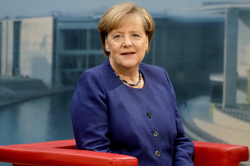 
              German Chancellor Angela Merkel waits for the start of the annual 'Summer Interview' with the German broadcasting service ARD in Berlin, Germany, Sunday, July 16, 2017. (AP Photo/Michael Sohn)
            